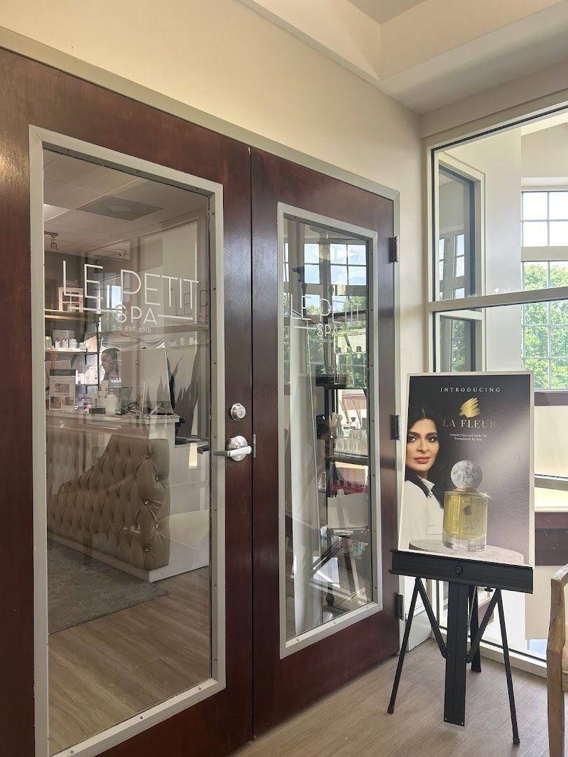 The etched glass entrance doors at Le Petit Spa SouthPark
