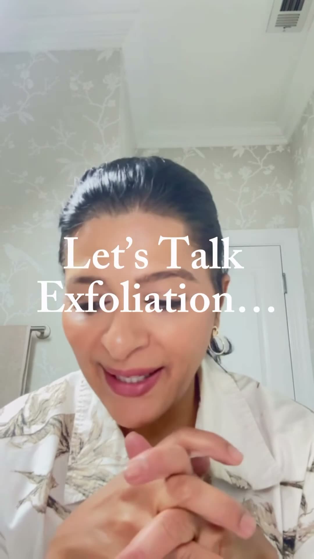 Priti Patel explaining exfoliation to camera at Le Petit Spa